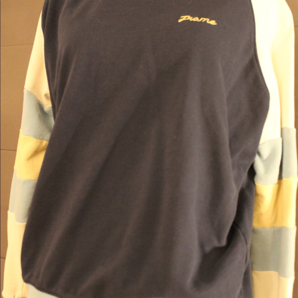 Blue sweatshirt. says frame and white, light blue, and yellow sleeves size small